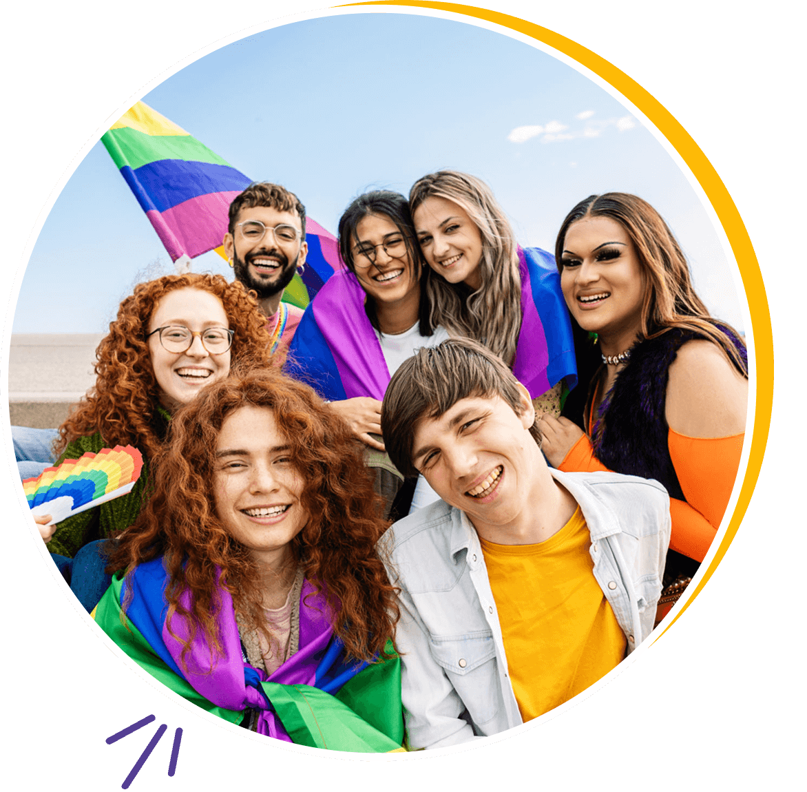 Group celebrating with pride flags outdoors.