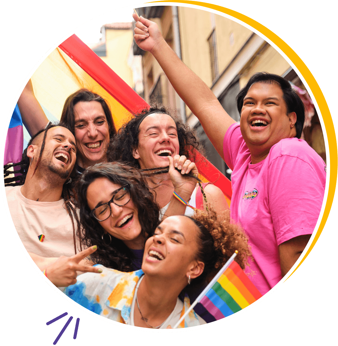 Group celebrating with rainbow flags, smiling joyfully.
