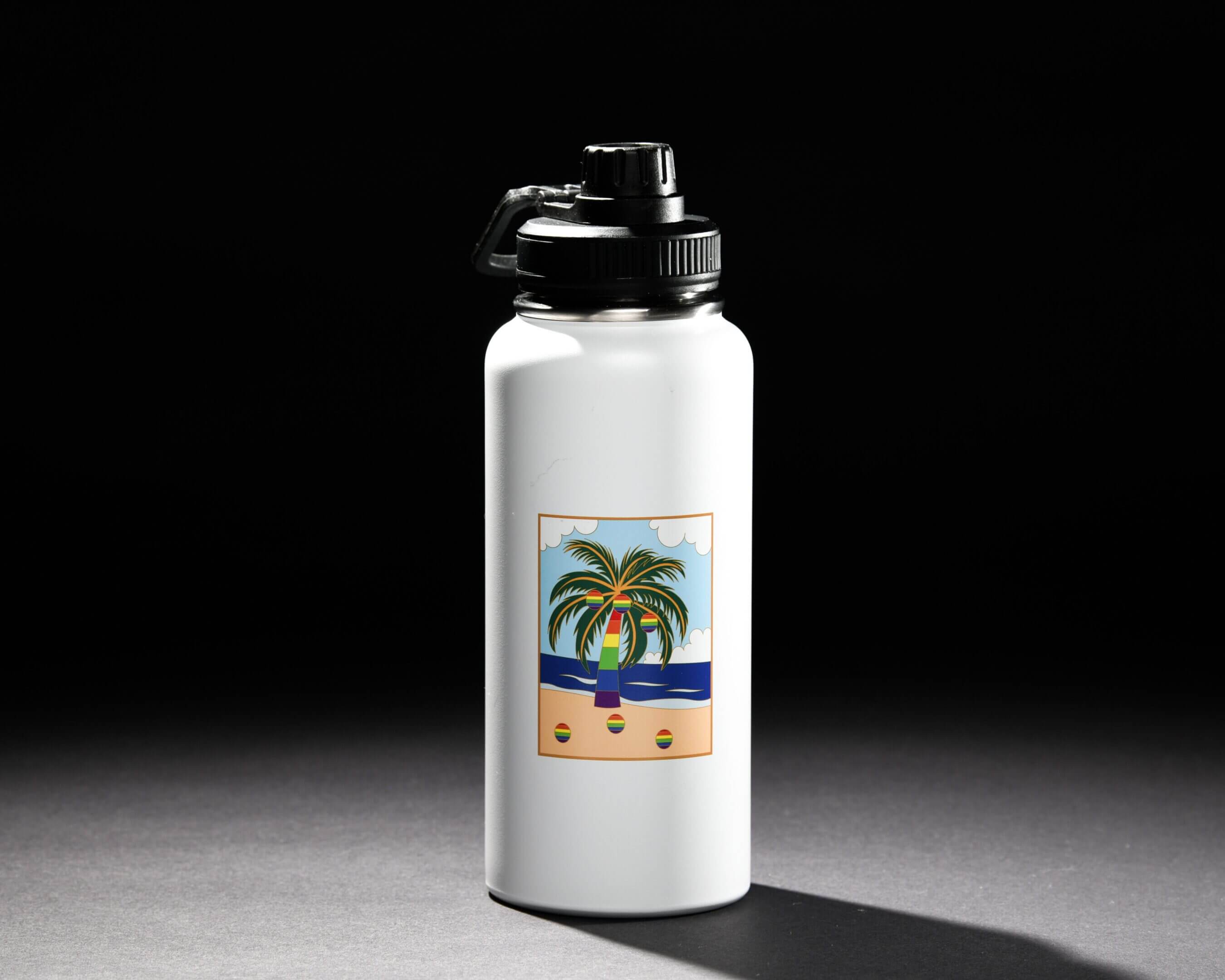 White water bottle with a tropical beach design under studio lighting.