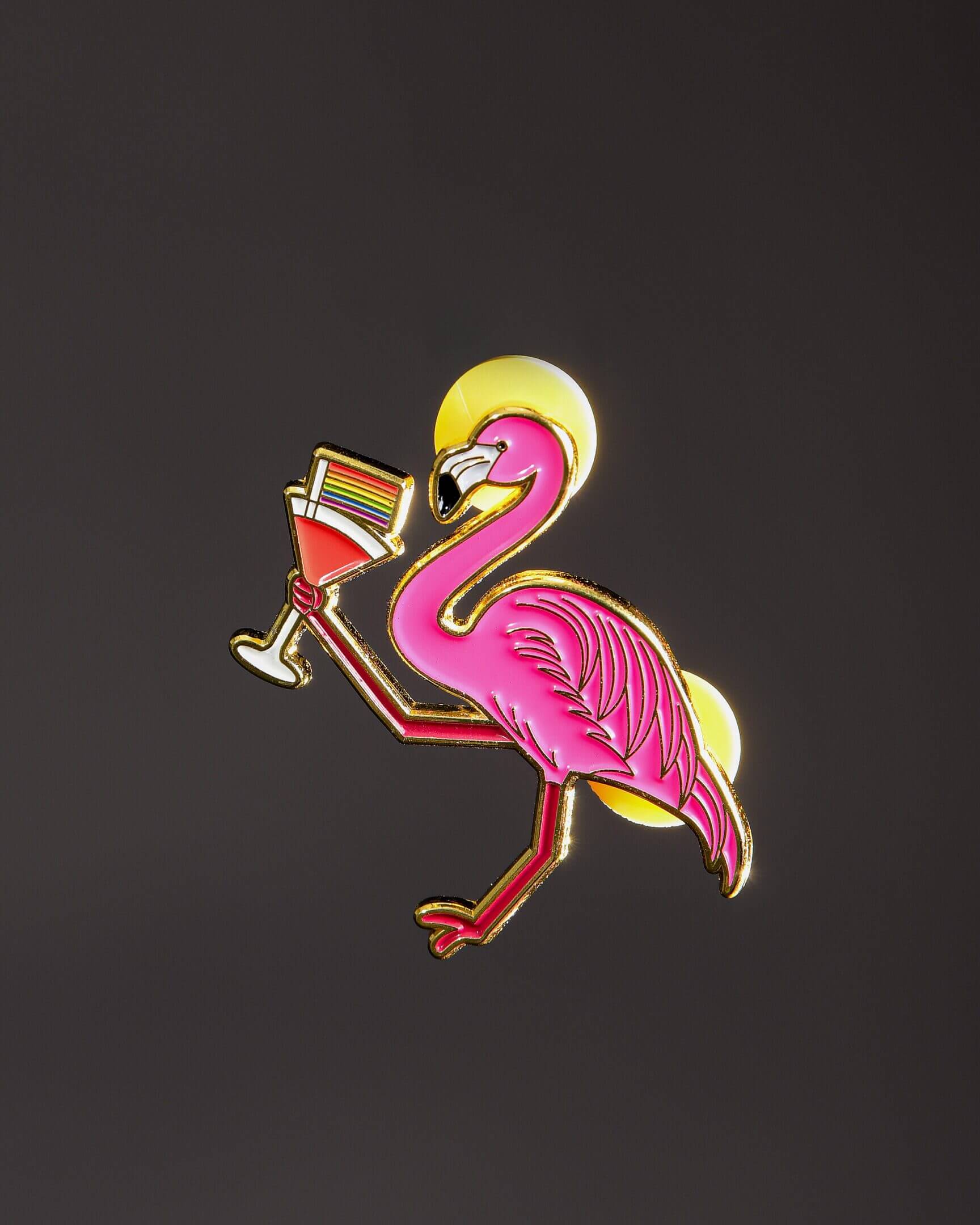 Pink flamingo holding a cocktail glass.