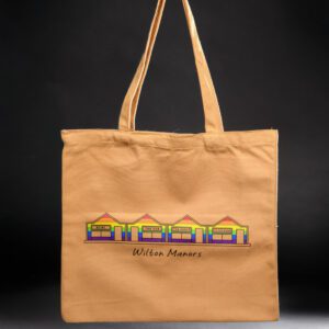 Beige tote bag with colorful house design.