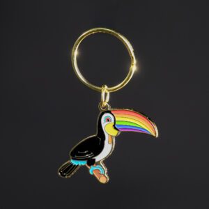 Toucan keychain with rainbow beak design.
