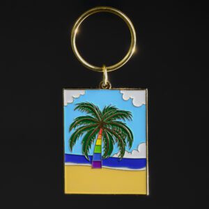 Keychain with colorful palm tree design.