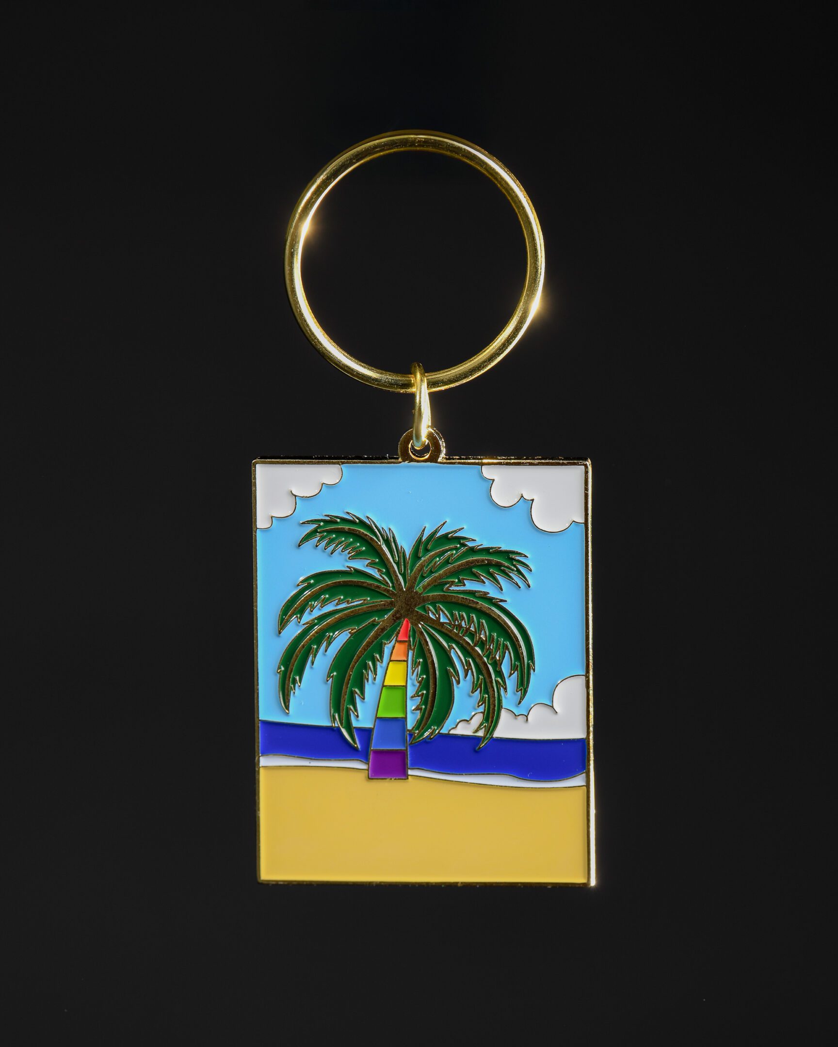 Keychain with colorful palm tree design.
