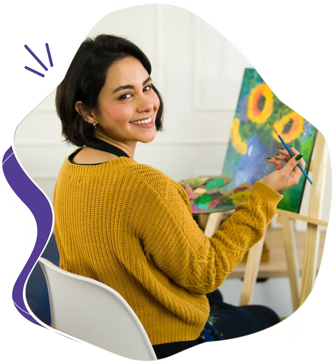 A woman painting sunflowers on a canvas indoors.