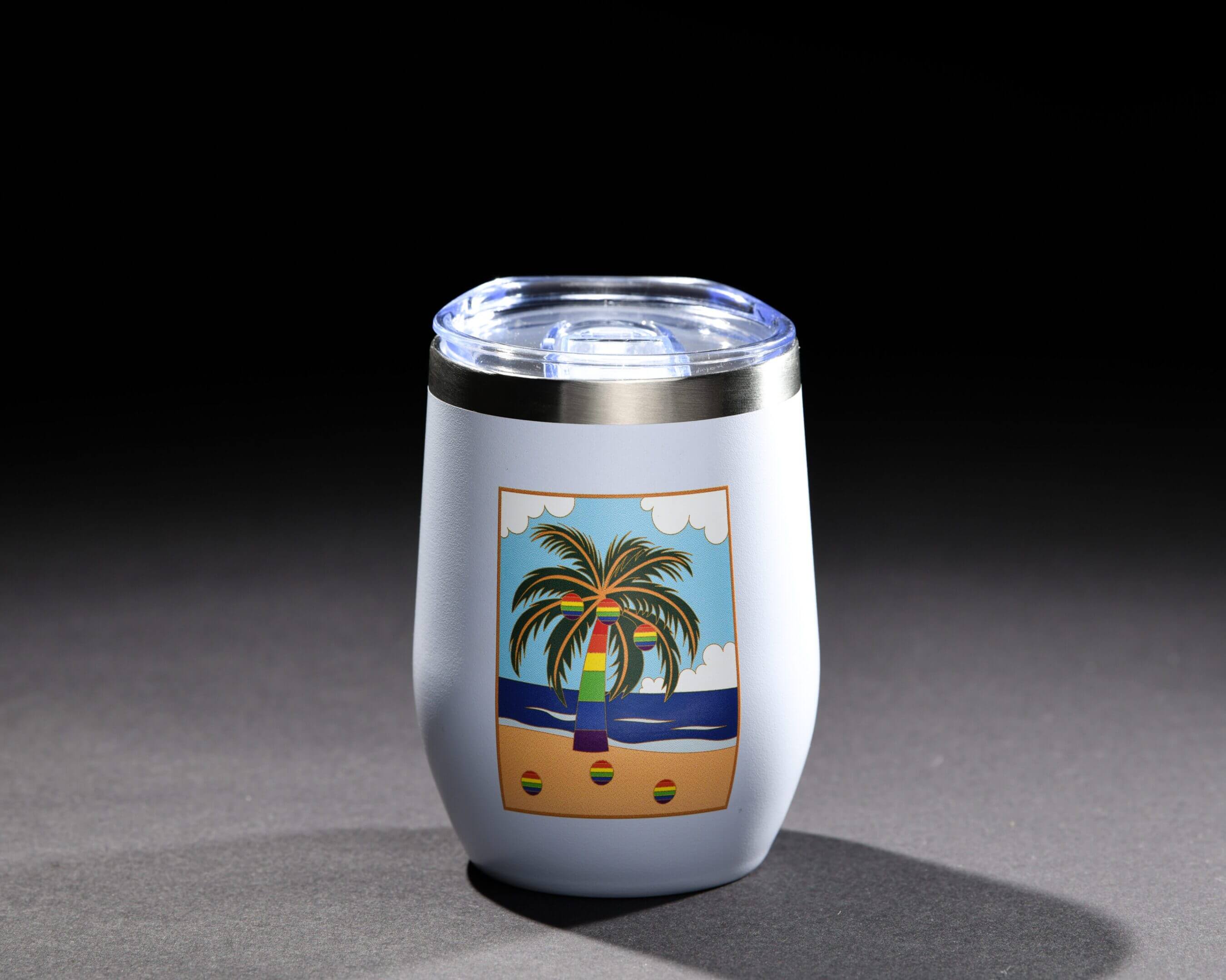 Stainless steel tumbler with a colorful beach scene design.