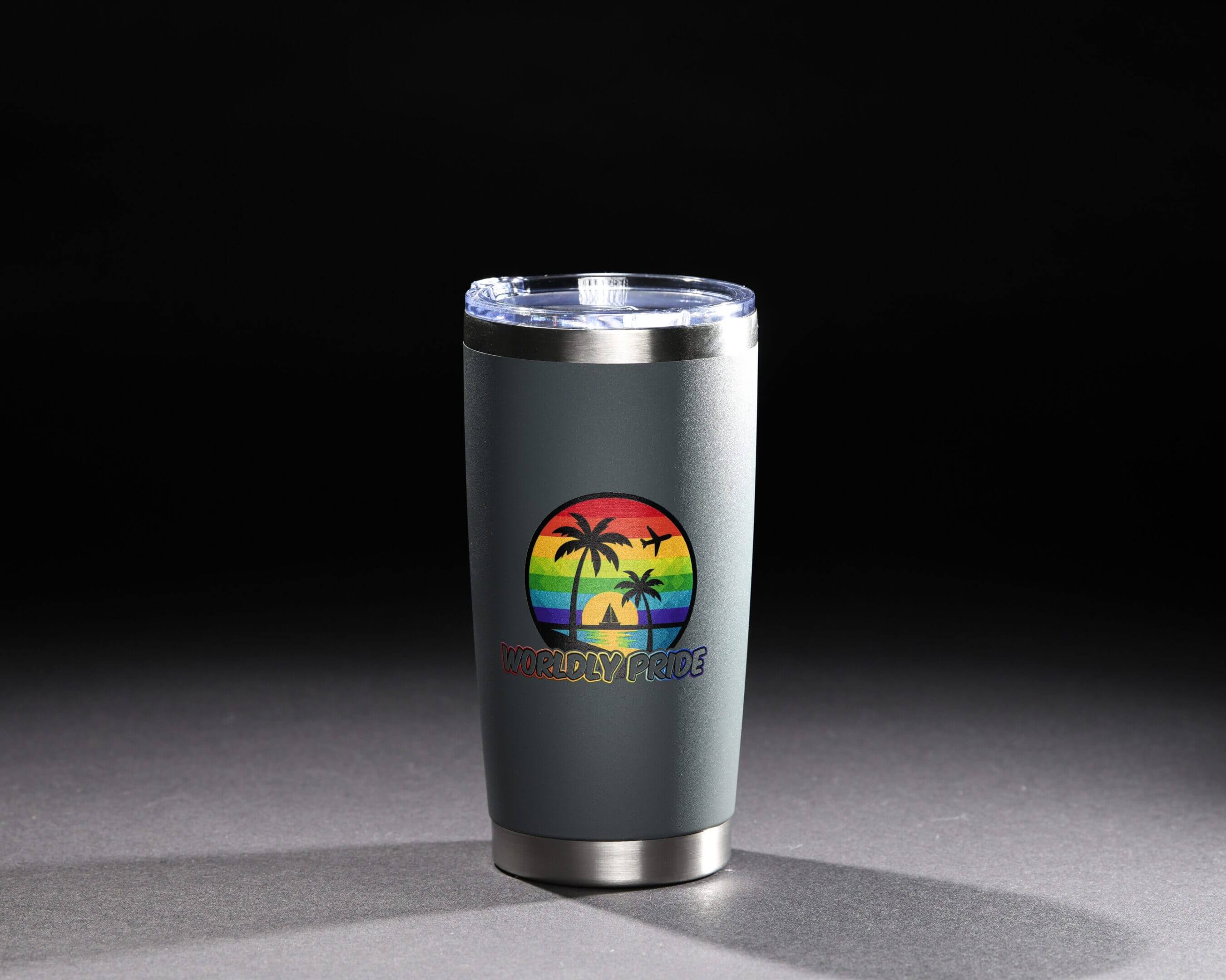 Stainless steel tumbler with a colorful tropical beach design on a black background.